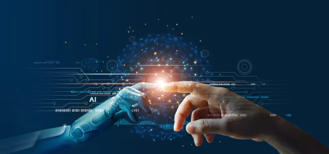 Hands of robot and human touching